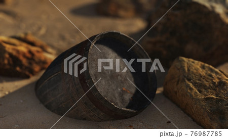 old wooden barrel at sand beach 76987785