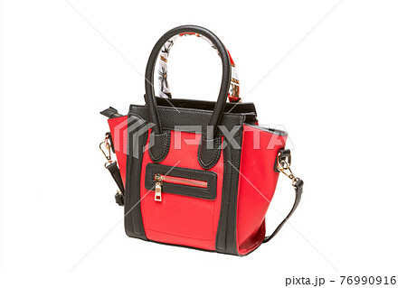 red female bag with black handles, decoration on the handle, isolated on white background red female bag with black handles, decoration on the handle, isolated on white background 76990916