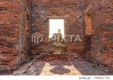 Ancient temple in Ayutthaya, Thailand. The temple is on the site of the old Royal Palace of ancient capital of Ayutthaya 76991791