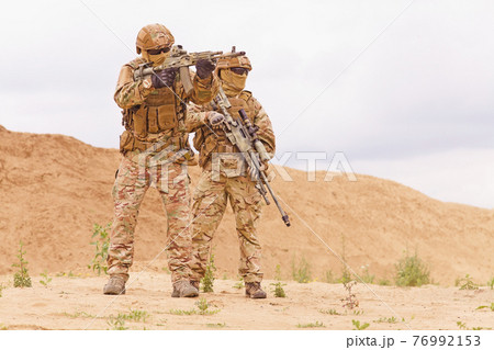 Two special forces snipers in the desert. 76992153