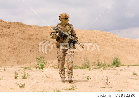 Equipped and armed special forces soldier Equipped and armed special forces soldier 76992230
