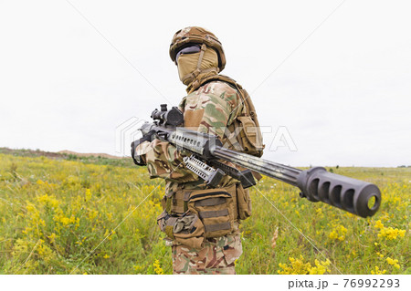 Equipped and armed special forces soldier in the field Equipped and armed special forces soldier in the field 76992293