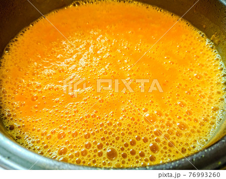 Beautiful colored cream pumpkin soup, top view 76993260
