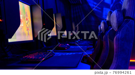 Inside of illuminated internet cybercafe Inside of illuminated internet cybercafe 76994261