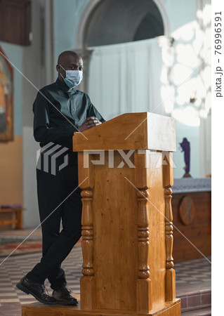 Man performing during mass Man performing during mass 76996591