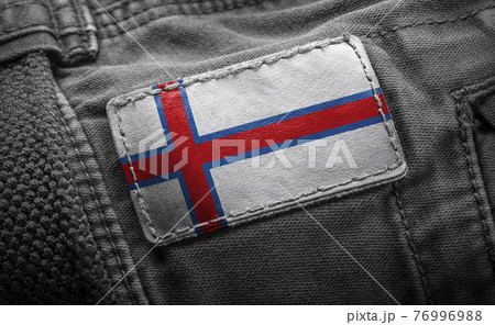 Tag on dark clothing in the form of the flag of the Faroe Islands 76996988
