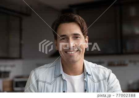 Headshot portrait of smiling man talk on video call 77002388