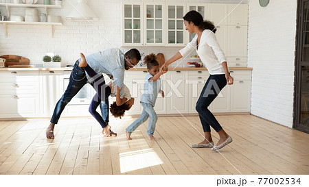 Excited African American family celebrating moving into new house 77002534