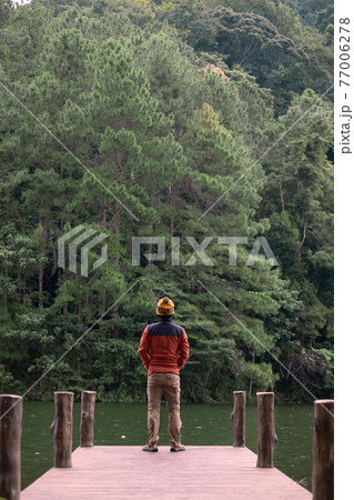 Happy traveler man standing and looking Nature view, solo tourist in sweater traveling at Pang Oung, Mae Hong Son, Thailand. travel, trip and vacation concept Happy traveler man standing and looking Nature view, solo tourist in sweater traveling at Pang Oung, Mae Hong Son, Thailand. travel, trip and vacation concept 77006278