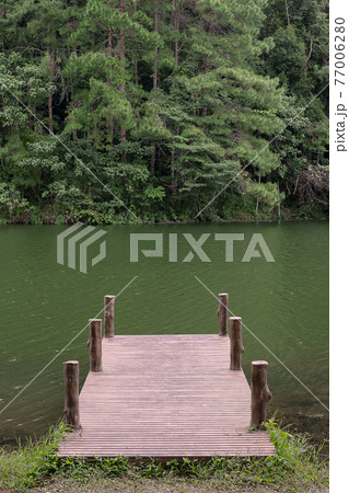 Bridge against lake and forest Nature background at Pang Oung, Mae Hong Son, Thailand. travel, outdoor, natural and vacation concept Bridge against lake and forest Nature background at Pang Oung, Mae Hong Son, Thailand. travel, outdoor, natural and vacation concept 77006280