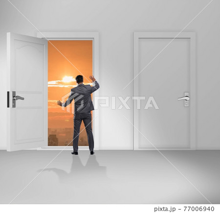 Businessman facing many business opportunities Businessman facing many business opportunities 77006940
