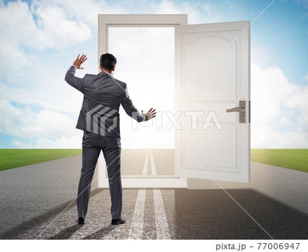 Businessman in front of door in business opportunities concept 77006947