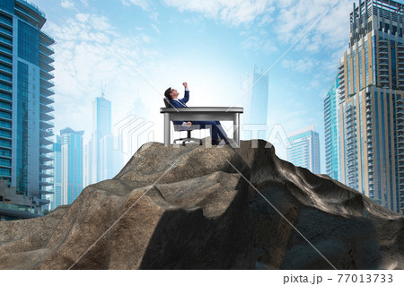 Businessman self isolating on the top Businessman self isolating on the top 77013733