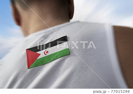 The national flag of Sahrawi on the athlete's back The national flag of Sahrawi on the athlete's back 77015299