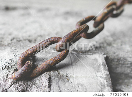 Rusty chain in the cement Rusty chain in the cement 77019403