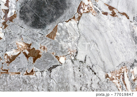 A background of peeling paint and rusty old stone. 77019847