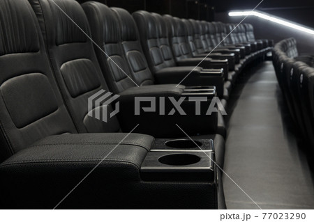 Empty Black Leather Seats In Row At Movie Theater Empty Black Leather Seats In Row At Movie Theater 77023290