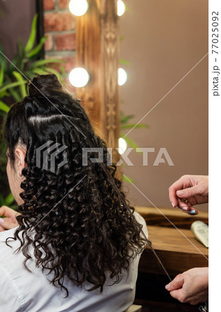 Hair styling process. Afro curls Hair styling process. Afro curls 77025092