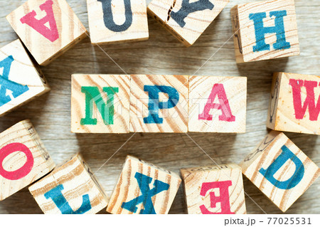Alphabet letter block in word NPA (Abbreviation of Non performing assets or Nasopharyngeal airway) with another on wood background Alphabet letter block in word NPA (Abbreviation of Non performing assets or Nasopharyngeal airway) with another on wood background 77025531