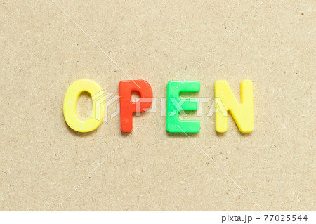 Color alphabet letter with word open on wood background 77025544