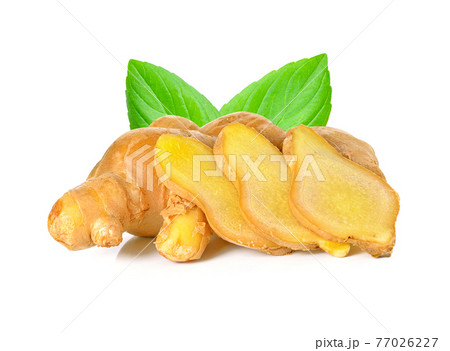 Fresh ginger rhizome with sliced and green leaves isolated on white background. Fresh ginger rhizome with sliced and green leaves isolated on white background. 77026227