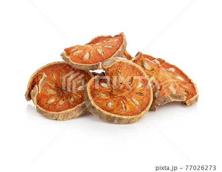 Aegle marmelos. Dry bael fruit on white background 77026273