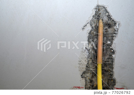 Hidden installation of electrical wires in a concrete wall Hidden installation of electrical wires in a concrete wall 77026792