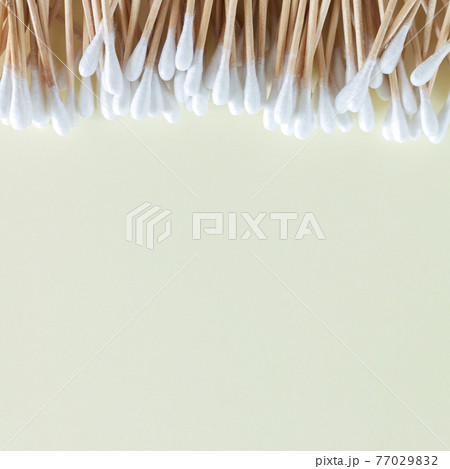 Heap of bamboo cotton swabs or buds top view on beige background Heap of bamboo cotton swabs or buds top view on beige background 77029832