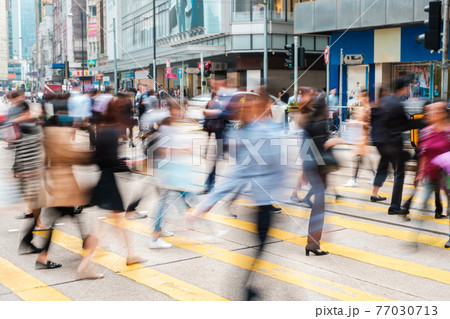 blur image of pedestrian walking, crossing street busy city blur image of pedestrian walking, crossing street busy city 77030713