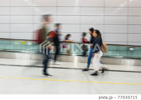 Motion blur of people walking Motion blur of people walking 77030715