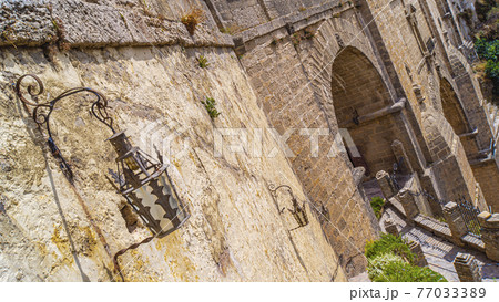 The Puente Nuevo New Bridge over Guadalevin River in Ronda 77033389