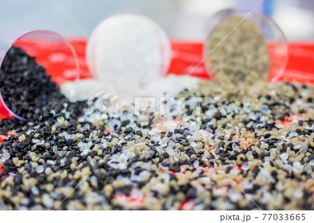 Plastic recycling - heap of secondary granules - close up 77033665