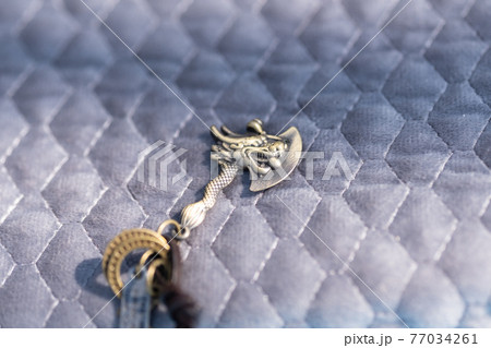 Vintage gothic pendant ax necklace bronze color closeup. Selective Focus 77034261