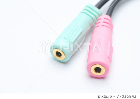 Audio video adapter cable with trrs jack to trs connectors on a white background 77035842