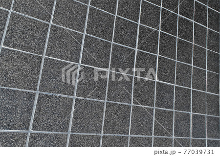 gray street paving slabs. texture background abstraction 77039731