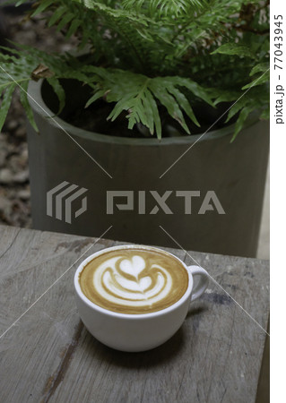 Handcraft of hot milk coffee cup 77043945