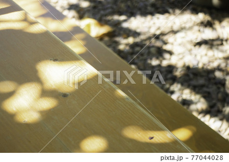 Empty wooden table top and light bokeh Empty wooden table top and light bokeh 77044028