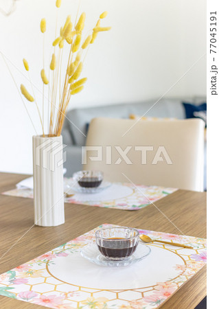Coffee time. Table decorated with button plant 77045191