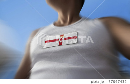 The national flag of Northern Ireland on the athlete's chest The national flag of Northern Ireland on the athlete's chest 77047432