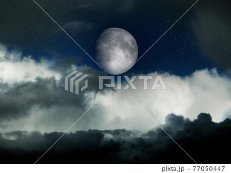 The moon in the night sky 77050447