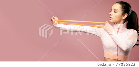 Website header of Charming young woman in sportswear using fitness band Website header of Charming young woman in sportswear using fitness band 77055822