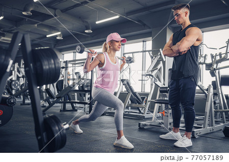 Side view of focused and motivated sporty young girl in sportswe 77057189