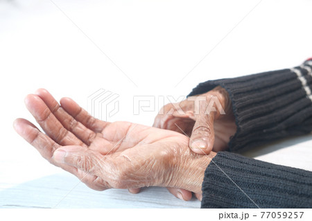 Elderly woman suffering from pain isolated on white Elderly woman suffering from pain isolated on white 77059257