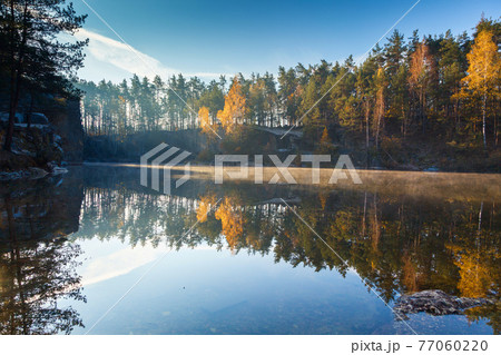 Fragment of the lake in the autumn forest Fragment of the lake in the autumn forest 77060220