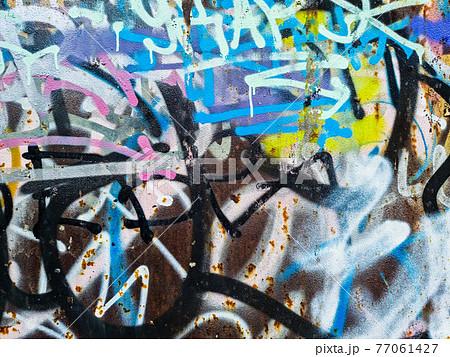 close up of colorful messy painted urban wall texture 77061427