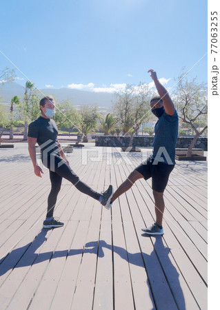 Covid greeting with elbows 77063255