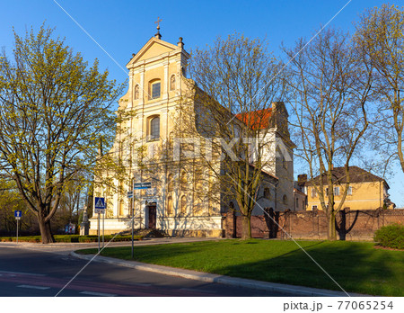 Poznan. Church of St. Wojciech on a sunny morning. 77065254