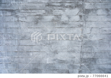 Texture of grey stained cement brick block wall Texture of grey stained cement brick block wall 77066641