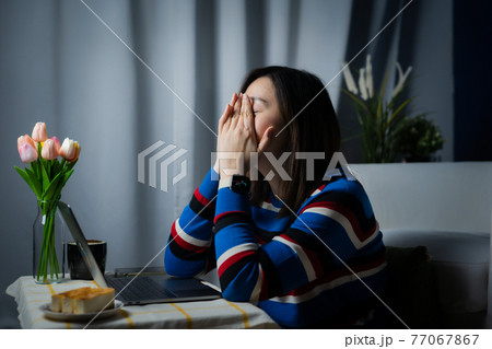 asian woman working from home with tired and strain after use online telecomunication system for meeting and coworking during stage quarantine asian woman working from home with tired and strain after use online telecomunication system for meeting and coworking during stage quarantine 77067867