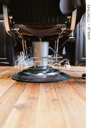 Barbershop chair, close-up rear view mechanism of professional hairdressing chair 77067945